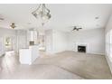 Spacious living room featuring neutral walls, a fireplace, and a combined kitchen dining area at 712 Bent Hickory Rd, Charleston, SC 29414