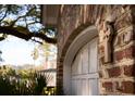Close up on the brick detailing of the exterior of the home showing a religious cross on the archway at 731 Pitt St, Mount Pleasant, SC 29464