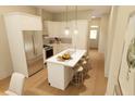Well-equipped kitchen featuring stainless steel appliances, stylish pendant lighting, and a functional island with seating at 7424 Indigo Palms Way, Johns Island, SC 29455