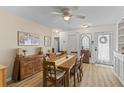 Spacious dining area featuring a ceiling fan, wood table, and an abundance of natural light at 8 Duffers Ct. # A, Charleston, SC 29414