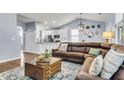 Cozy living room open to the kitchen, featuring vaulted ceilings, lots of space and natural light at 117 Back Tee Cir, Summerville, SC 29485