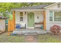 Inviting front porch with cozy seating and stylish decor, perfect for relaxing outdoors at 1188 Camden St, North Charleston, SC 29405