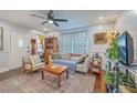 Bright living room with hardwood floors, ceiling fan, and comfortable seating arrangement at 1188 Camden St, North Charleston, SC 29405