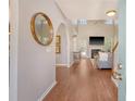 Inviting living room with hardwood floors, a fireplace, and an open layout, offering a seamless transition to the kitchen at 1310 Belhaven Dr, Mount Pleasant, SC 29466