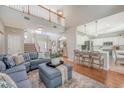 Expansive living space with soaring ceilings, an open floor plan, and modern furnishings connecting the living room and kitchen at 1310 Belhaven Dr, Mount Pleasant, SC 29466