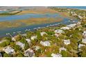 Aerial view of the property highlighting its proximity to the water, marina, and surrounding neighborhood at 1316 Thompson, Sullivans Island, SC 29482