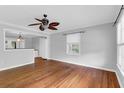 Bright and spacious living room with hardwood floors, crown molding, and plenty of natural light at 1785 N Mayflower Dr, Charleston, SC 29412