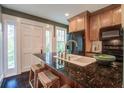 Modern kitchen with granite countertops, stainless steel appliances, and a breakfast bar at 22 Ashton St, Charleston, SC 29403