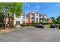Charming condo complex with well-maintained landscaping and convenient parking at 2221 Chatelain Way, Mount Pleasant, SC 29464