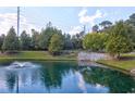Scenic pond view featuring a fountain surrounded by lush greenery and walking paths at 2221 Chatelain Way, Mount Pleasant, SC 29464