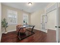 Bright home office with hardwood floors, plantation shutters, and French doors for added privacy at 2242 Terrabrook Ln, Charleston, SC 29412