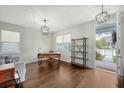 Well-lit home office with hardwood floors, a sleek desk, and plenty of natural light at 227 Oak View Way, Summerville, SC 29483