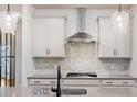 Close-up of the kitchen featuring granite countertops, stainless steel appliances, tile backsplash, and pendant lighting at 265 Lucca Dr, Summerville, SC 29486