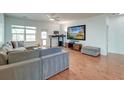 Bright living room with hardwood floors, neutral tones, and a large sectional sofa at 2914 Glenarden Dr, Charleston, SC 29414