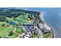 Expansive aerial shot of 293 Atrium Villa highlighting golf course, community pool, and beach access at 2933 Atrium Villa Dr # 33, Seabrook Island, SC 29455