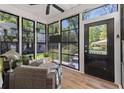Cozy screened porch with comfortable seating, offering a relaxing indoor-outdoor experience at 3023 Macbeth Creek Dr, Charleston, SC 29414
