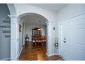 Inviting foyer with hardwood floors, decorative columns, and an open view to the dining room at 3363 Kinross Ct, Summerville, SC 29485