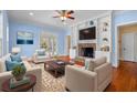 Cozy living room with a brick fireplace, built-in bookshelves, and comfortable seating at 345 Mentor Rd, Summerville, SC 29483