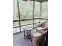 Cozy screened porch with comfortable wicker furniture, perfect for enjoying the outdoors with privacy at 4262 Mariners Watch, Kiawah Island, SC 29455