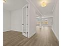 Bright hallway with wood floors leading to a spacious living area with natural light at 503 Fiskdale Cir, Summerville, SC 29486