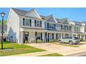 Attractive exterior of a two-story home with manicured lawn and convenient parking at 518 Green Fern Dr, Summerville, SC 29483