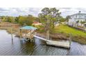 Wooden walkway to private dock offering stunning water views and a relaxing retreat at 545 Towles Crossing Dr # 29455, Johns Island, SC 29455