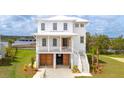 Beautiful two-story home boasts a covered porch, garage, and a charming coastal aesthetic at 545 Towles Crossing Dr # 29455, Johns Island, SC 29455