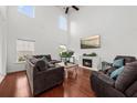 Sunlit living room with soaring ceilings, a fireplace, and comfortable seating for relaxed gatherings at 9652 Spencer Woods Rd, Ladson, SC 29456