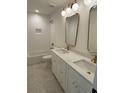 Elegant bathroom with dual vanities, marble countertops, modern fixtures, and stylish mirrors at 971 Beehive Rd, Awendaw, SC 29429
