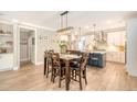 Bright dining area featuring a pendant light and an open layout with the kitchen at 1010 Deep Gap Rd, Ridgeville, SC 29472