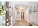 Inviting hallway with wood-look tile flooring and neutral wall paint at 1010 Deep Gap Rd, Ridgeville, SC 29472