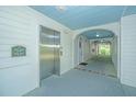 Well-lit hallway featuring an elevator and access to the units. Clean and well-maintained at 1022 Basildon Rd, Mount Pleasant, SC 29466