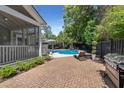 Private backyard oasis with a refreshing in-ground pool and brick patio at 106 Abigale Ln, Summerville, SC 29483