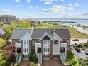 Scenic aerial view of townhomes near water offers picturesque surroundings and convenient location at 11 Harleston Pl, Charleston, SC 29401