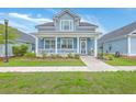 Charming two-story home with a welcoming front porch and well-maintained landscaping at 110 Angelica Ave, Summerville, SC 29483