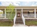 Welcoming front porch with a cozy atmosphere and classic brick facade at 110 Wallace Rd, Goose Creek, SC 29445