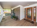 Enjoy outdoor living on the expansive front porch with rocking chairs and swing at 110 Wallace Rd, Goose Creek, SC 29445