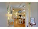 Sun-filled living and dining area with stylish decor, modern lighting, and hardwood floors at 1307 Ventura Pl, Mount Pleasant, SC 29464