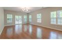 Bright living room with hardwood floors and glass patio doors at 1453 Joy Ave, Charleston, SC 29407