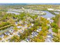 Stunning aerial view of a residential neighborhood with lush landscaping and a picturesque lake at 1543 Gemstone Dr, Mount Pleasant, SC 29464