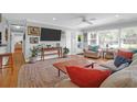 Bright, airy living room featuring hardwood floors, recessed lights, and large windows offering an open design at 17 24Th Ave, Isle of Palms, SC 29451