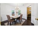 Bright dining room with neutral walls, a chandelier, and a dining table for four at 192 Bamert St, Summerville, SC 29483