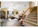 Spacious living room with vaulted ceilings, hardwood floors, plush seating, and a staircase at 192 Bamert St, Summerville, SC 29483