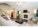 Comfortable living room featuring a fireplace, hardwood floors, ample seating, and natural light at 192 Bamert St, Summerville, SC 29483