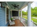 Inviting covered porch with comfortable seating and classic white columns at 2013 Grey Marsh Rd, Mount Pleasant, SC 29466