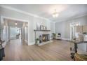Spacious living room with natural light, stylish furnishings, and an inviting fireplace as focal point at 2042 Highway 402, Moncks Corner, SC 29461