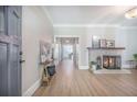 Bright living room features hardwood floors, a charming fireplace, and neutral decor throughout at 2042 Highway 402, Moncks Corner, SC 29461