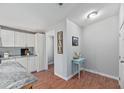 This kitchen area features a lovely accent table next to a picture of a cow and a light brown floor at 208 Langham Ct, Moncks Corner, SC 29461