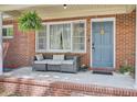 Inviting front porch with comfortable seating, perfect for relaxing outdoors at 237 Cypress Dr, Walterboro, SC 29488