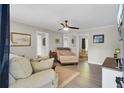Cozy living room features neutral tones, ceiling fan, and an open layout at 237 Cypress Dr, Walterboro, SC 29488
